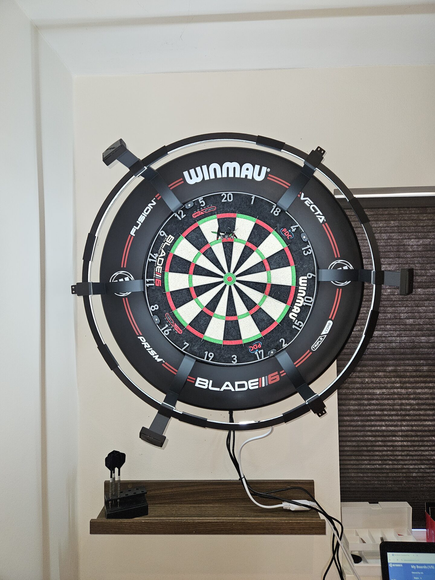 Assembled Mojos Dart Kit on a Winmau Blade 6 dartboard